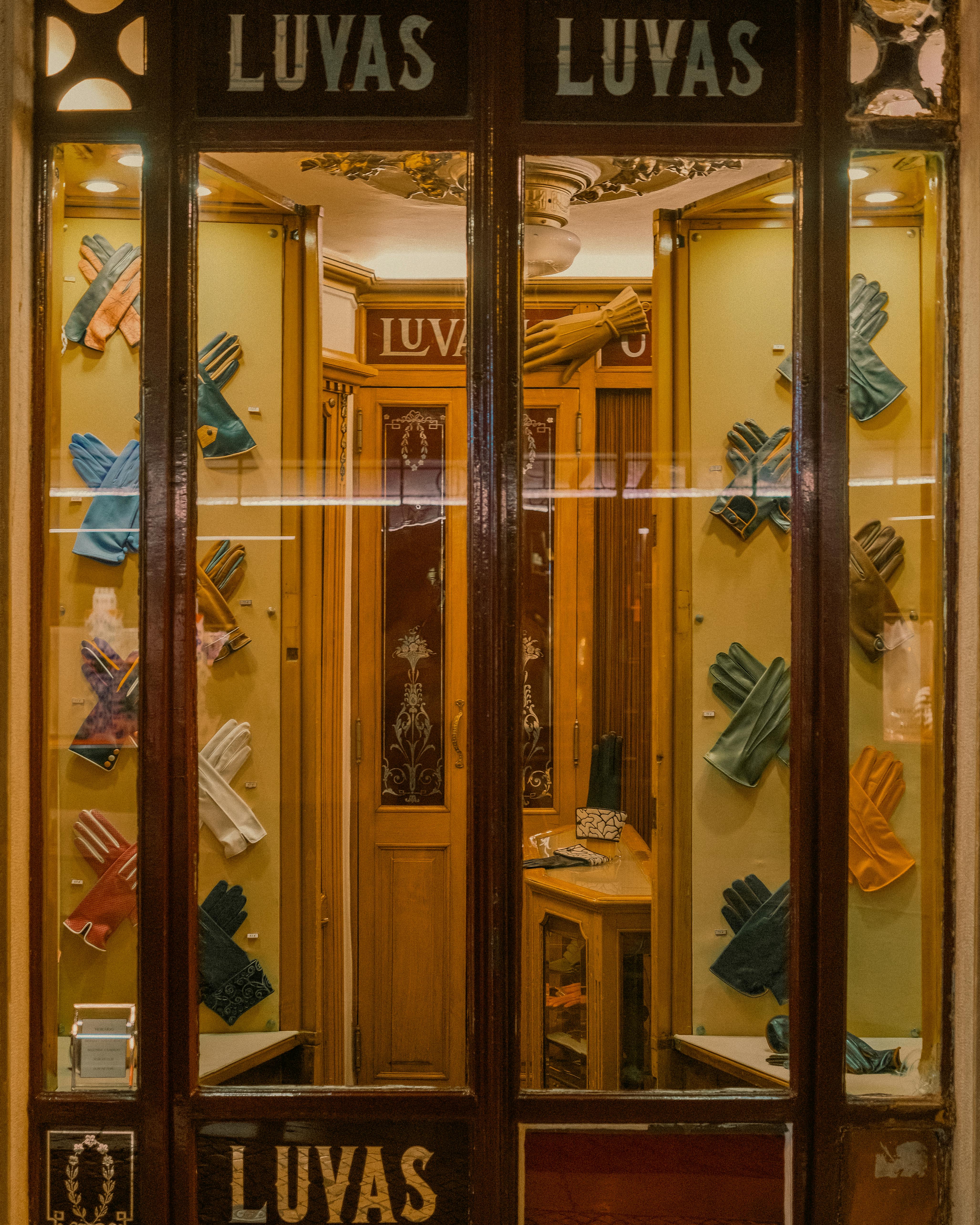 Showcase of colorful gloves at a traditional Lisbon glove shop. Charming urban scene.