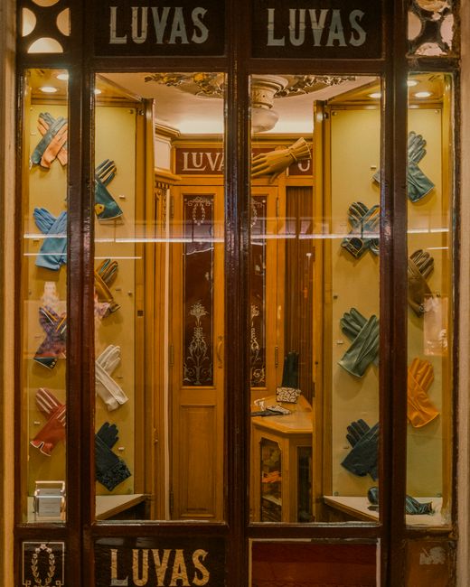 Showcase of colorful gloves at a traditional Lisbon glove shop. Charming urban scene.