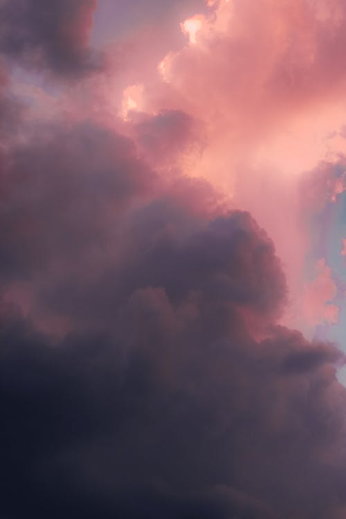 A pink and purple sky with clouds