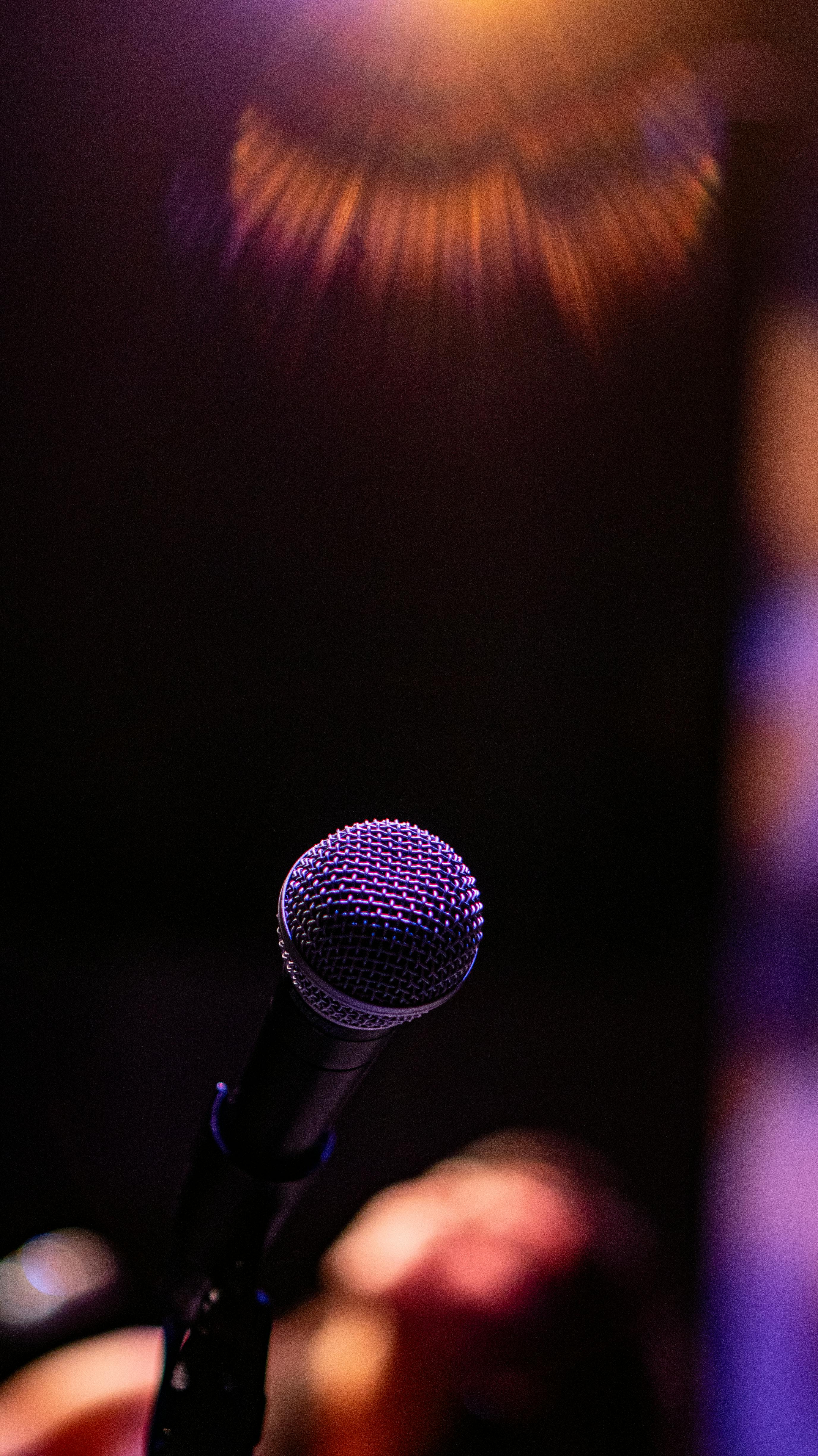 a microphone is shown in front of a stage