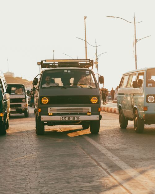 Free Retro Volkswagen vans parked in the warm sunlight in Boumerdes, Algeria, reflecting vintage travel vibes. Stock Photo