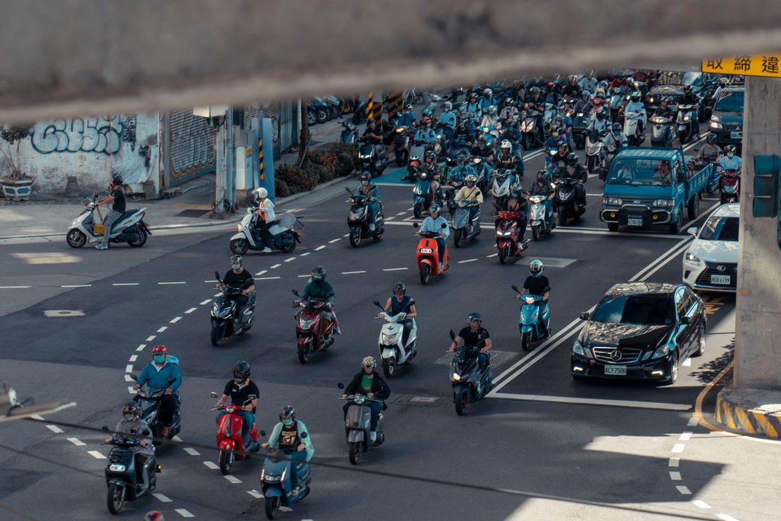 Street Riding Motorcycle A group of people riding motorcycles on a street · Free Stock Photo