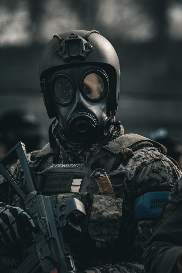 Portrait Of Soldier In Gas Mask