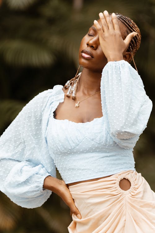 Woman in a White Blouse and Skirt 