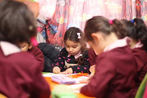 Kindergarten girl in the classroom