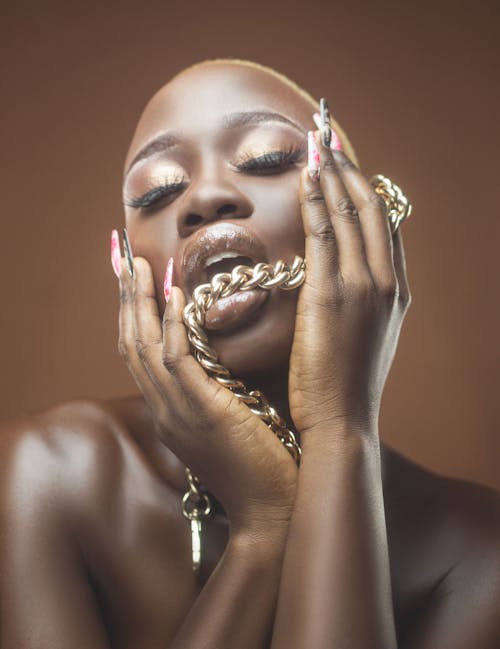 Woman Biting Golden Chain