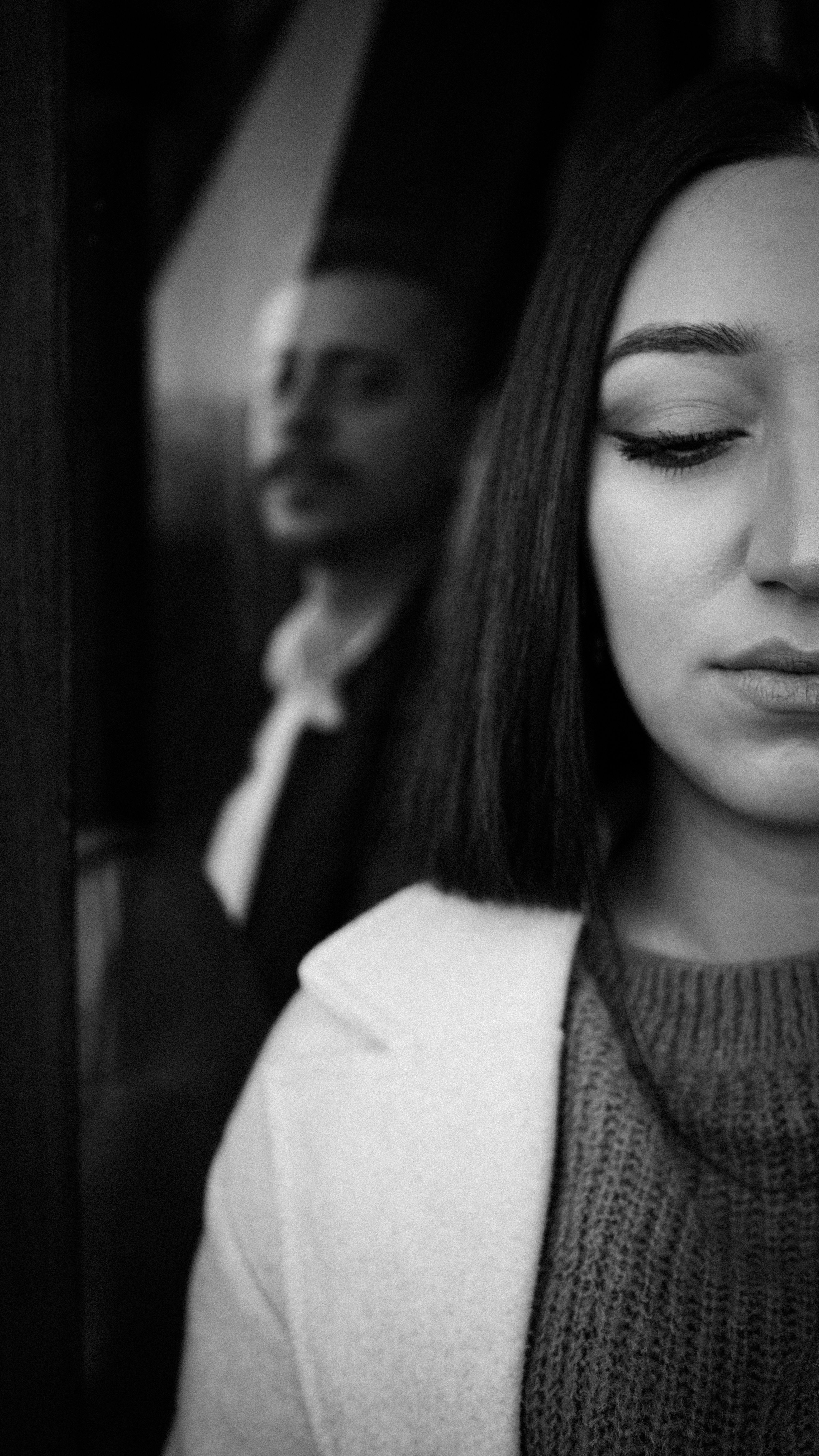Black and White Picture of a Woman and a Man Standing behind Her · Free ...