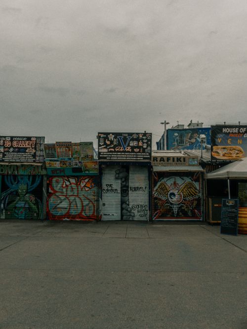 Free Colorful graffiti and street art on storefronts in Santa Monica, showcasing urban culture. Stock Photo