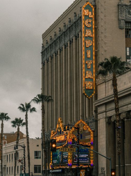 Free Iconic El Capitan Theatre in Hollywood, Los Angeles with vintage illuminated sign. Stock Photo