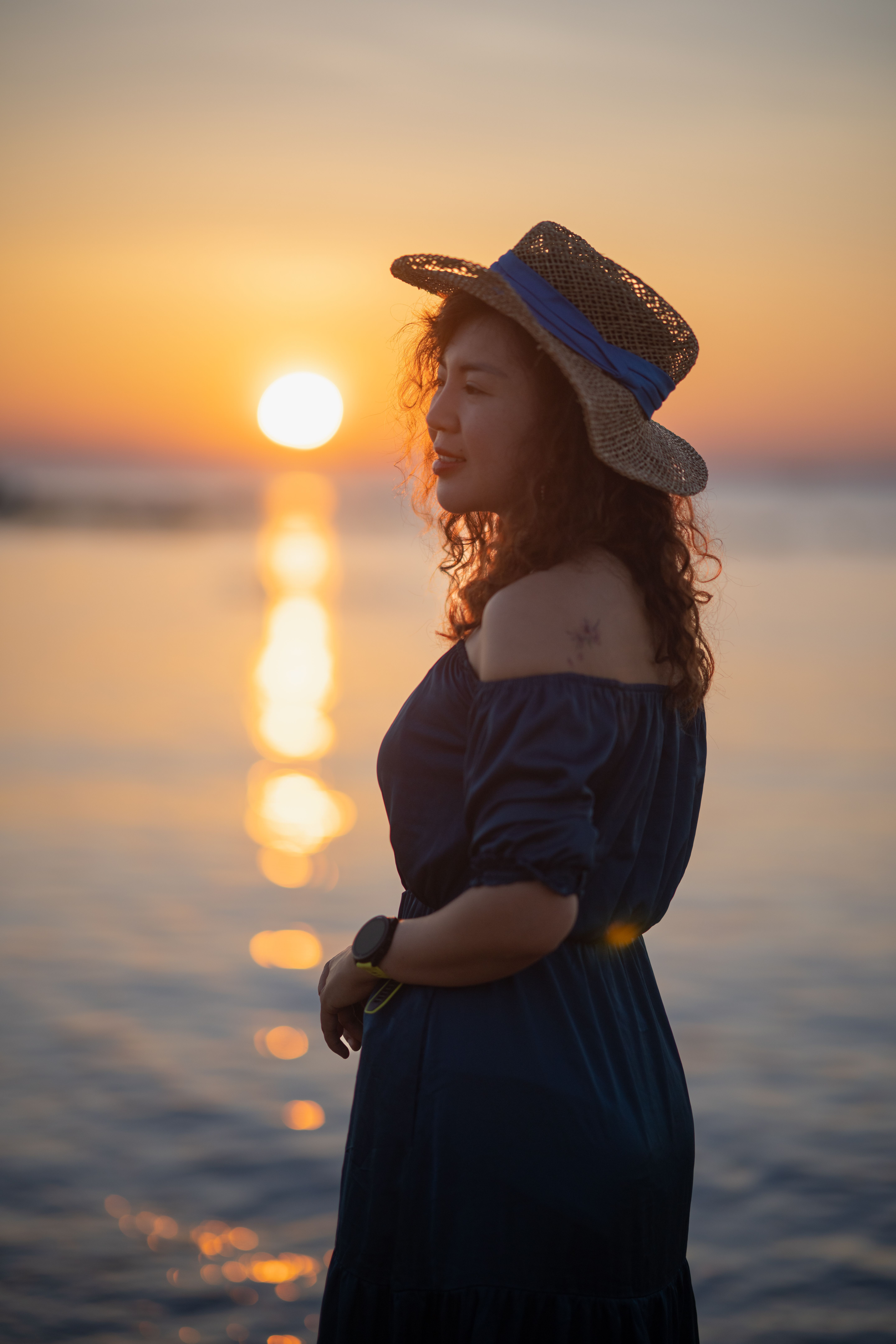 Woman in Hat on Sea Shore at Sunset · Free Stock Photo