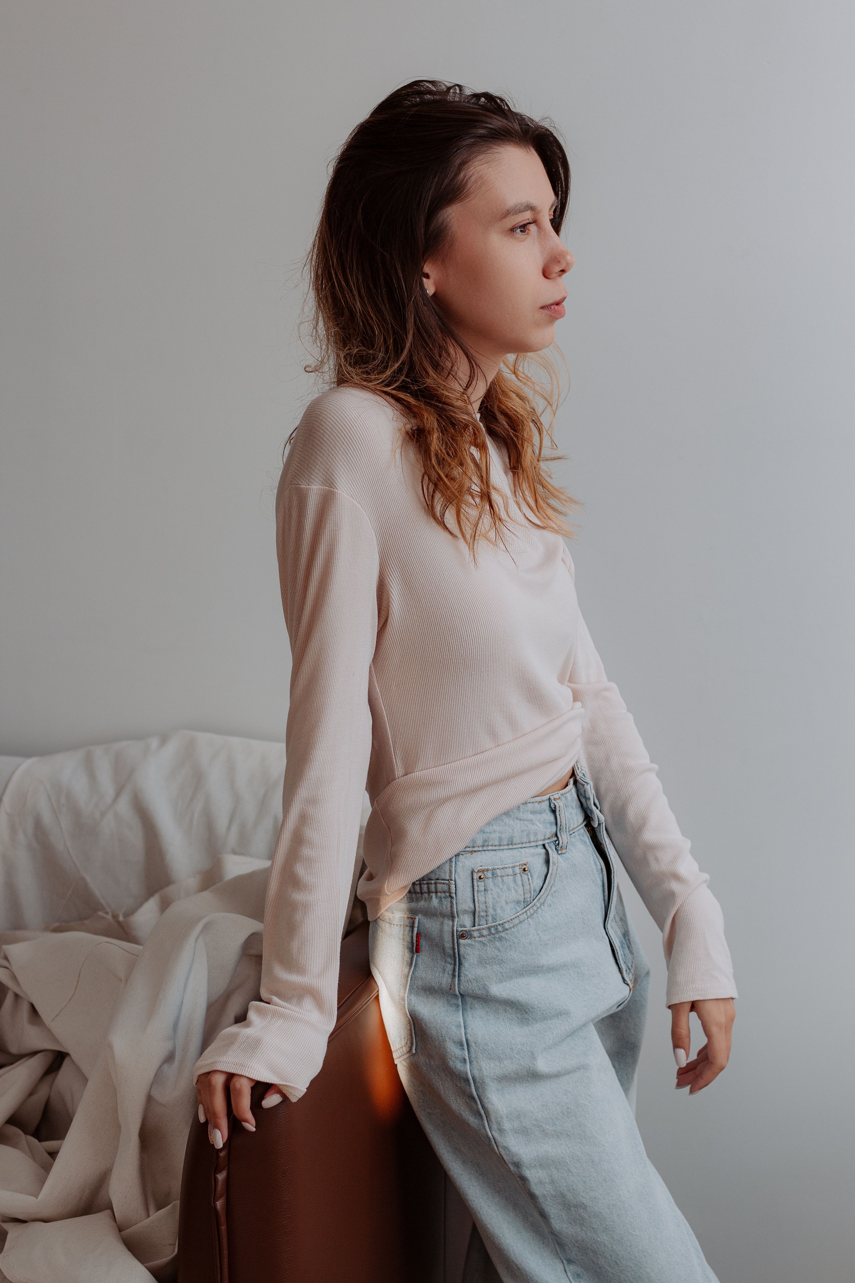 Woman in a pink sweater and jeans