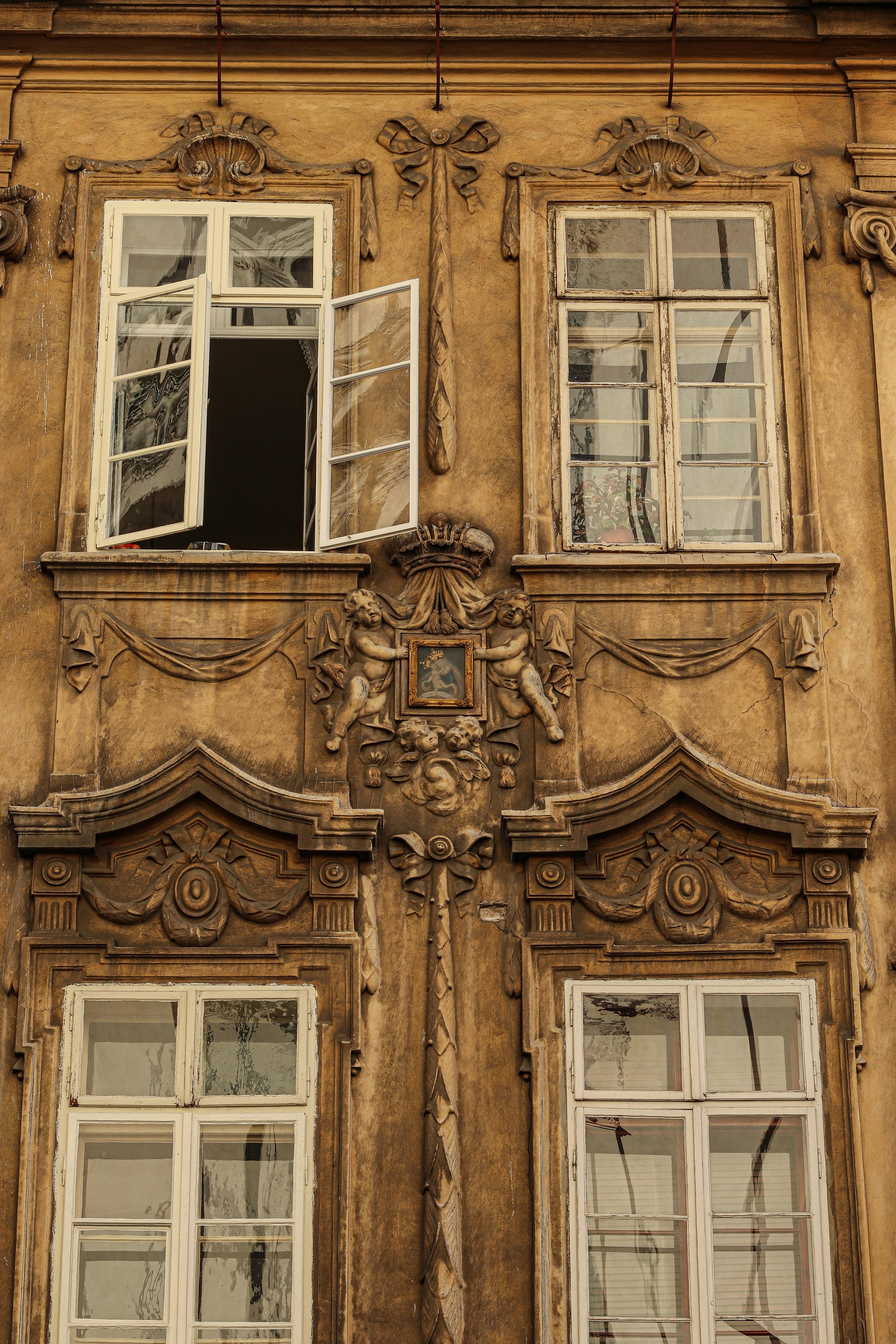 Detailed view of an ornate building facade in Prague, showcasing classic European architecture.