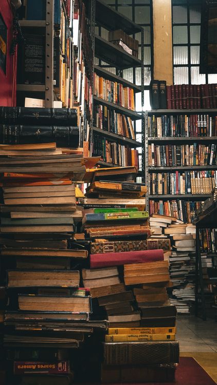 A stack of books in a library · Free Stock Photo