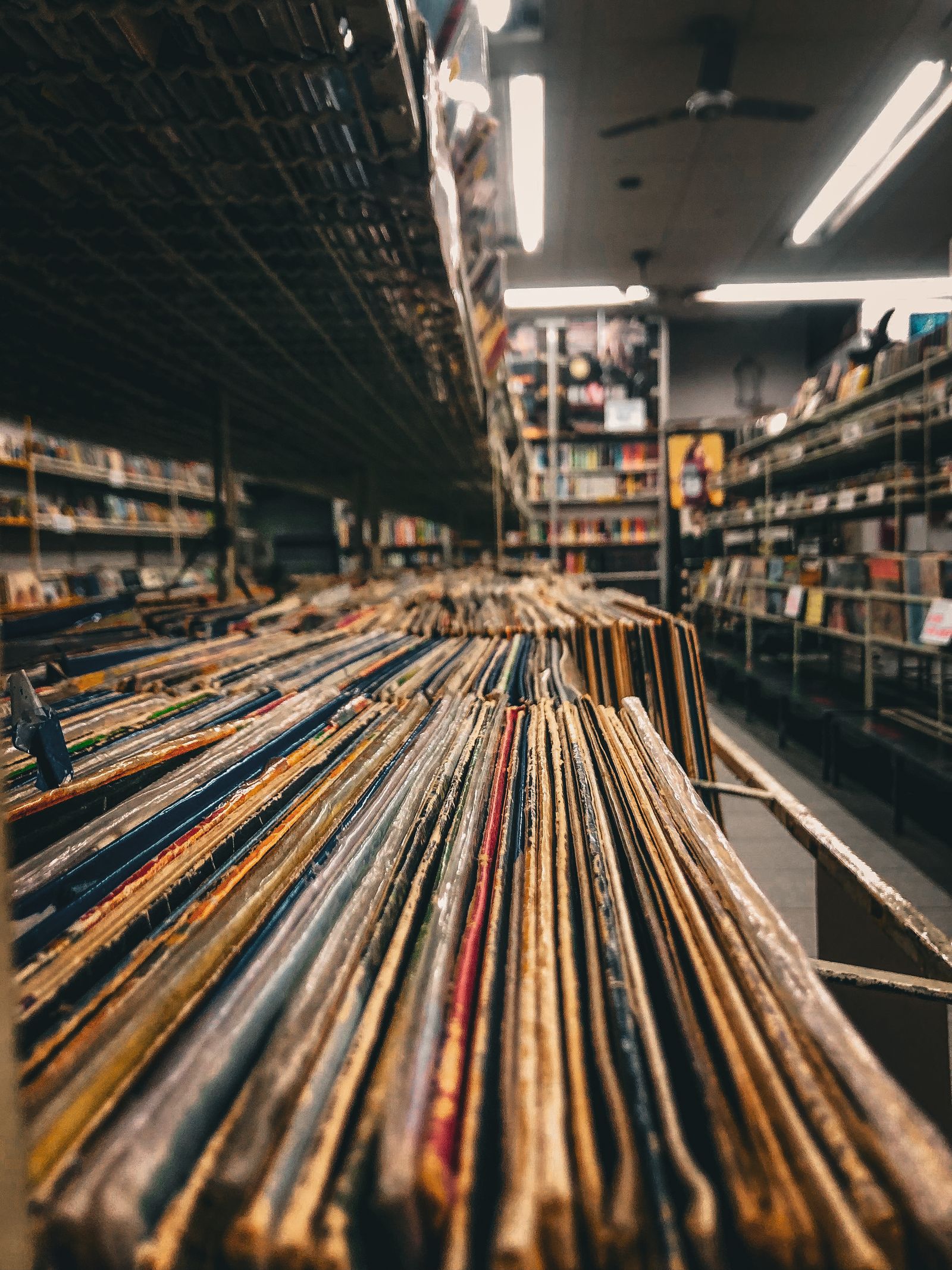 Record store aisle with vinyl stacked on shelves