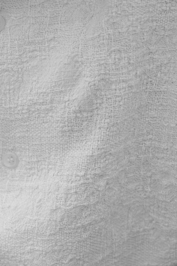 Creased white linen in flat daylight — Sacha Moreau on Pexels