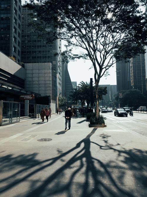 Free Urban street view with people walking under shadows in São Paulo. Stock Photo
