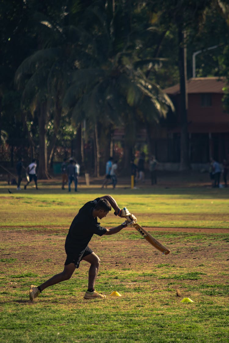 Man Playing Cricket