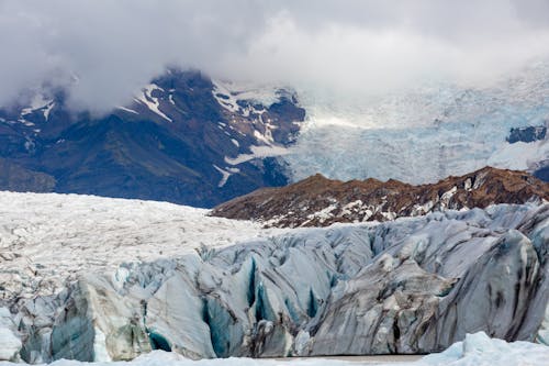 Panorama of a Glacier and Mountains in Fog