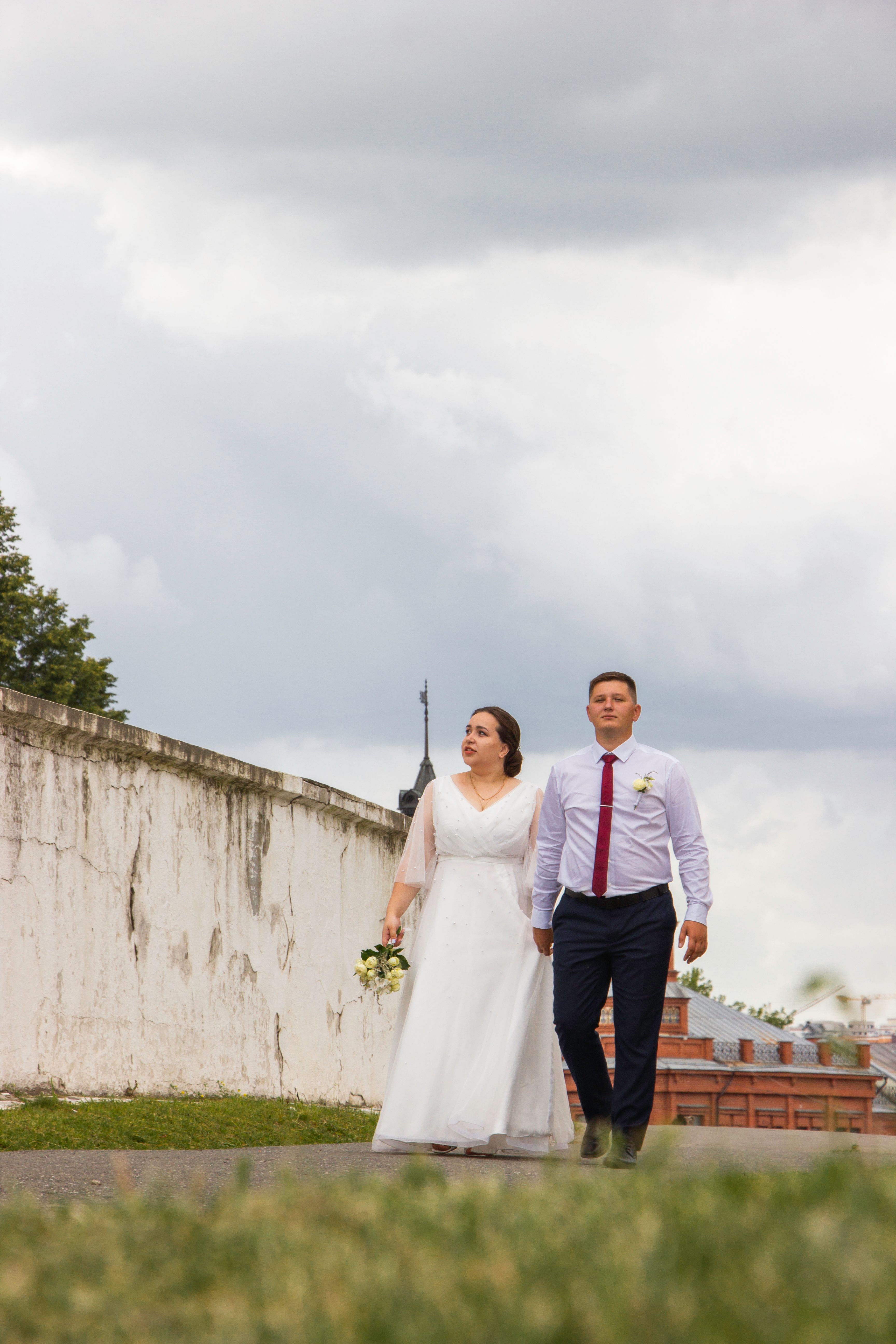 Wedding Couple Walking and Holding Hands · Free Stock Photo