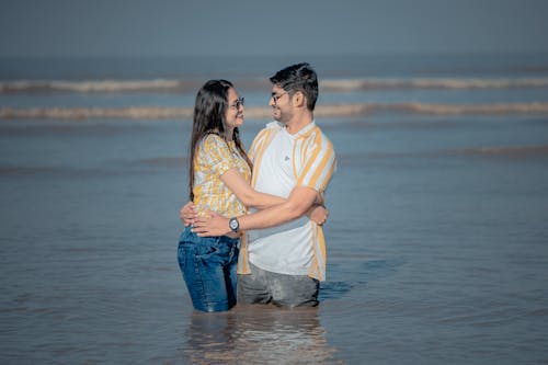 Couple Embracing in Coastal Water