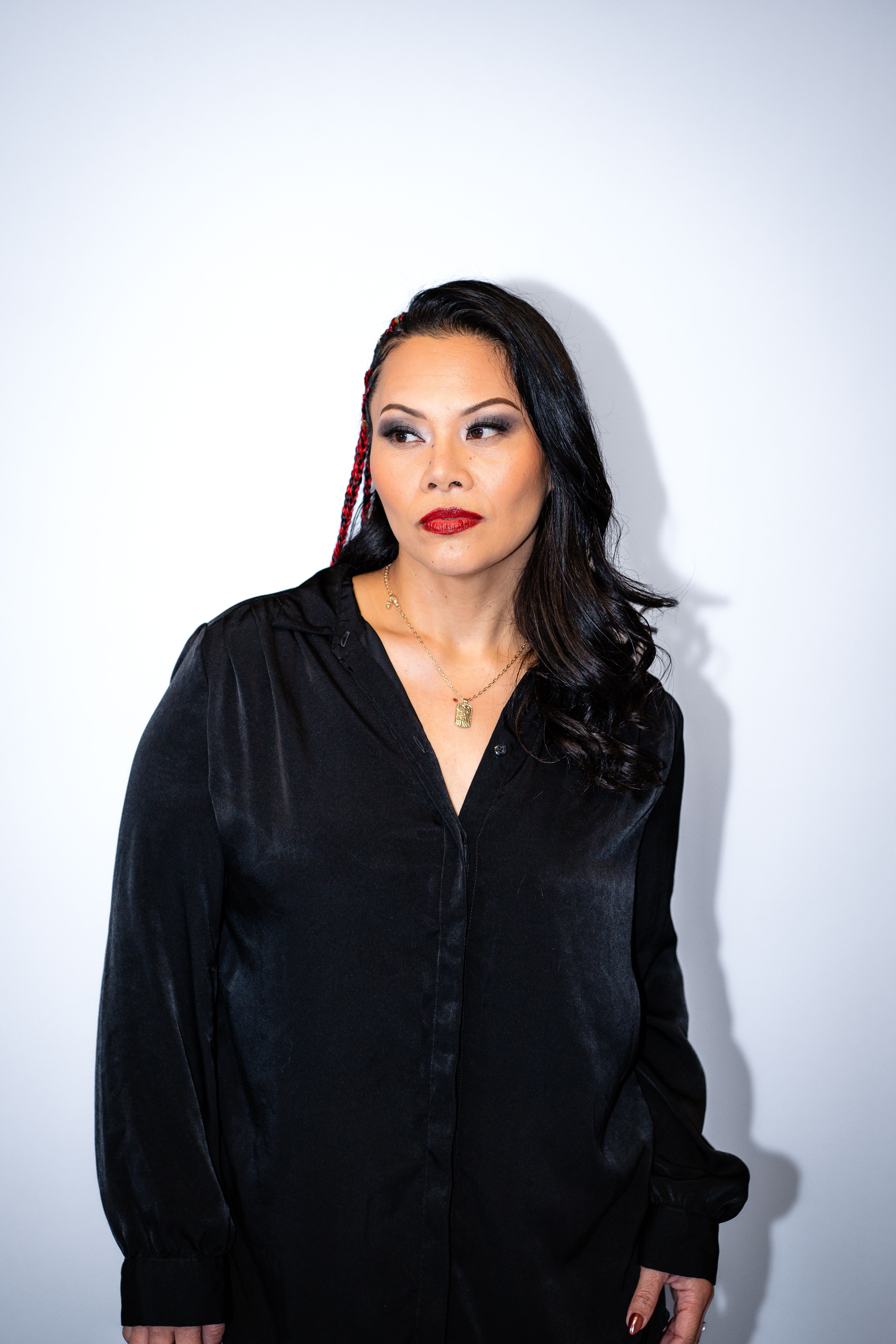 Studio Portrait of a Female Model Wearing a Black Blouse · Free Stock Photo