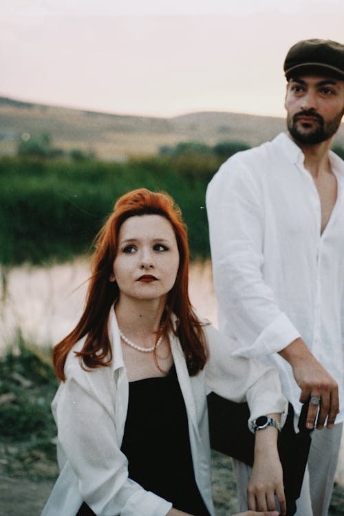 Elegant Man and Woman Posing Outside 