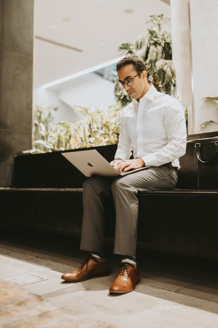 Man In Shirt Working On Laptop