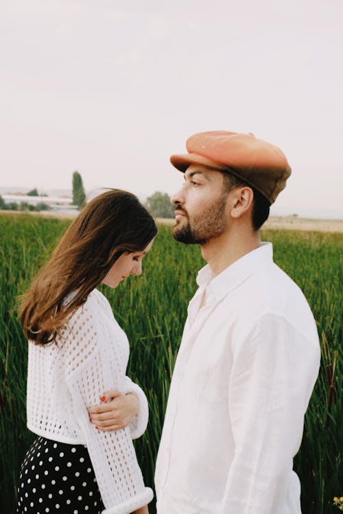 Elegant Man and Woman Posing Outside 