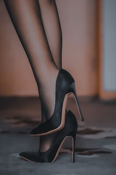 Black leather stiletto pumps. Photo by RANkzl on Pexels