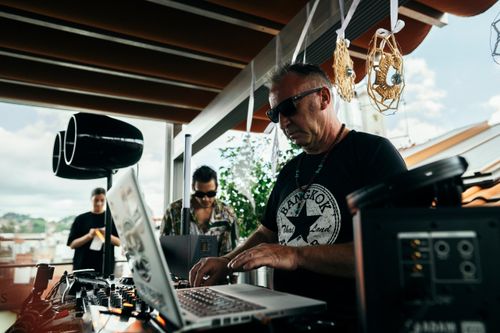Free DJ mixing tracks at an outdoor music event in Lwiw, Ukraine, with audio equipment. Stock Photo