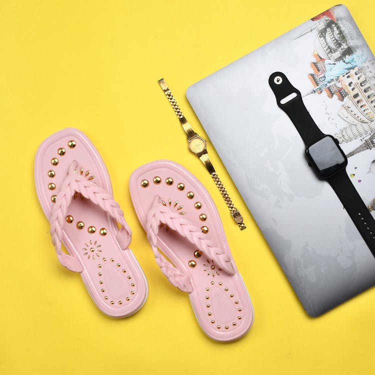 Elegant Flip Flops and Wristwatches Free Stock Photo