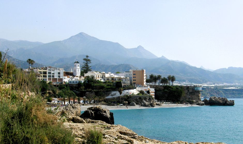 Coastal town of Nerja on the Costa del Sol, representing the cross-border UK-Spain property tax position