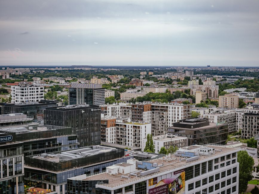 Modern Warsaw cityscape with an overlay suggesting 5G network coverage