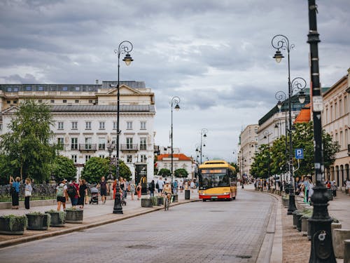 City Bus Driving on a Street in Warsaw Old Town, Poland