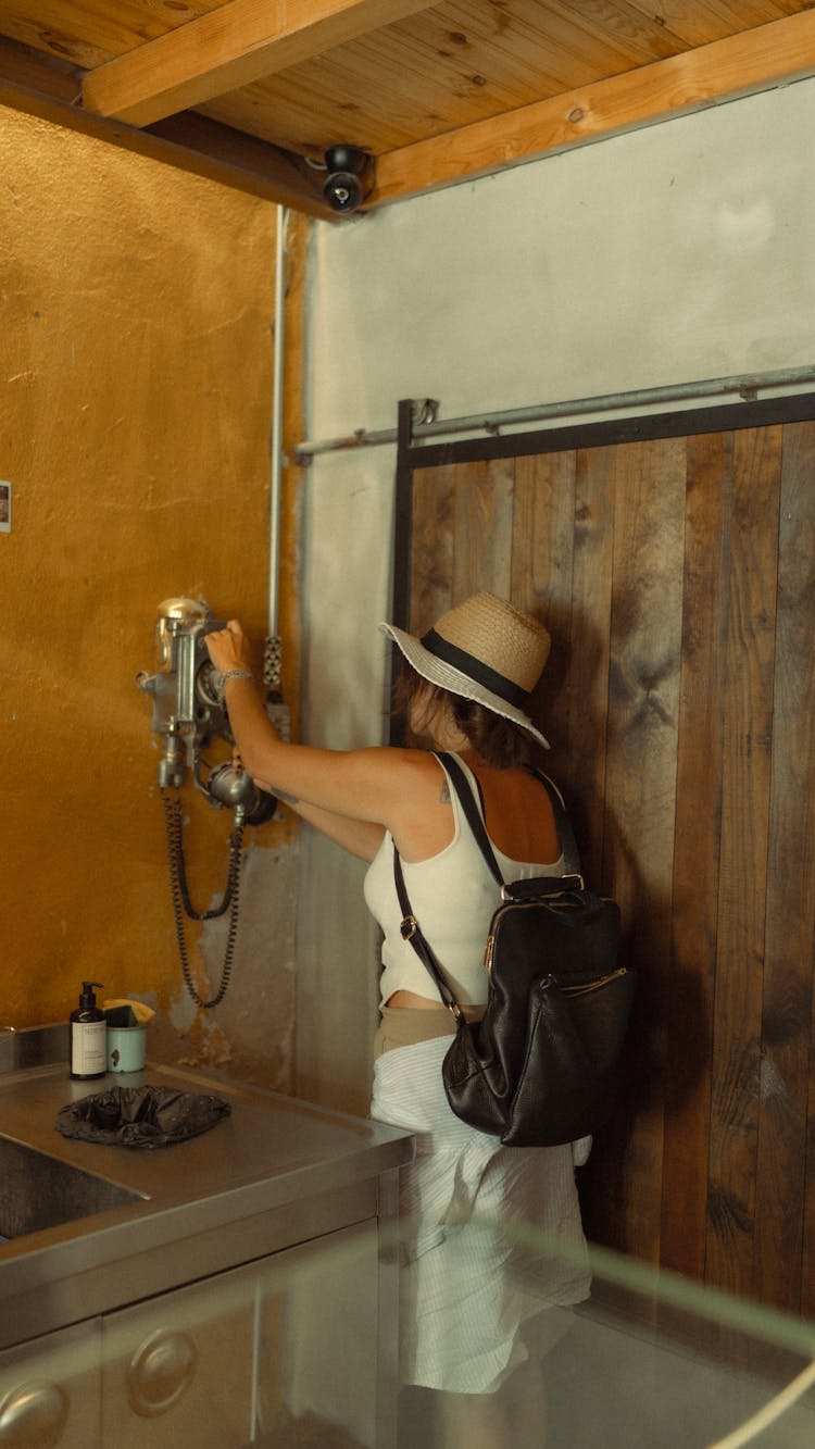 Woman Using An Old Sink