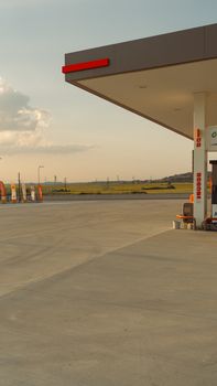 A tranquil view of a gas station in Keşan, Türkiye during sunset.