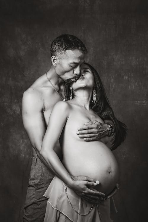 Free Kissing Pregnant Couple  Stock Photo