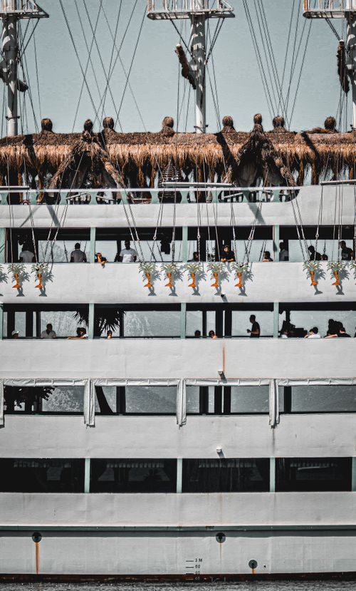 Free A multi-deck cruise ship with passengers enjoying the view in Antalya, Türkiye. Stock Photo