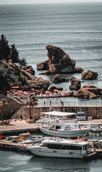 Aerial view of Antalya's Old City Marina with boats and rocky coastline.