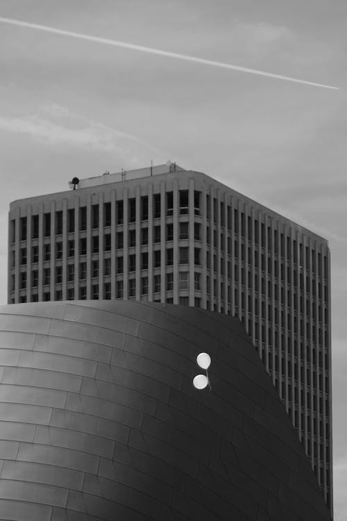 Balloons Floating against Skyscrapers