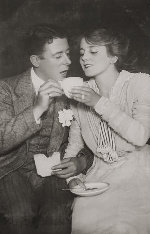 Couple Sitting Together and Drinking in Black and White