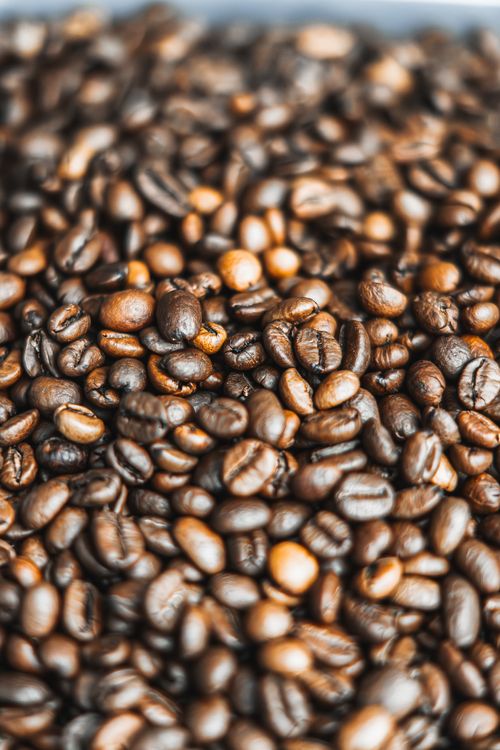 Free Detailed image of aromatic roasted coffee beans, perfect for coffee enthusiasts. Stock Photo
