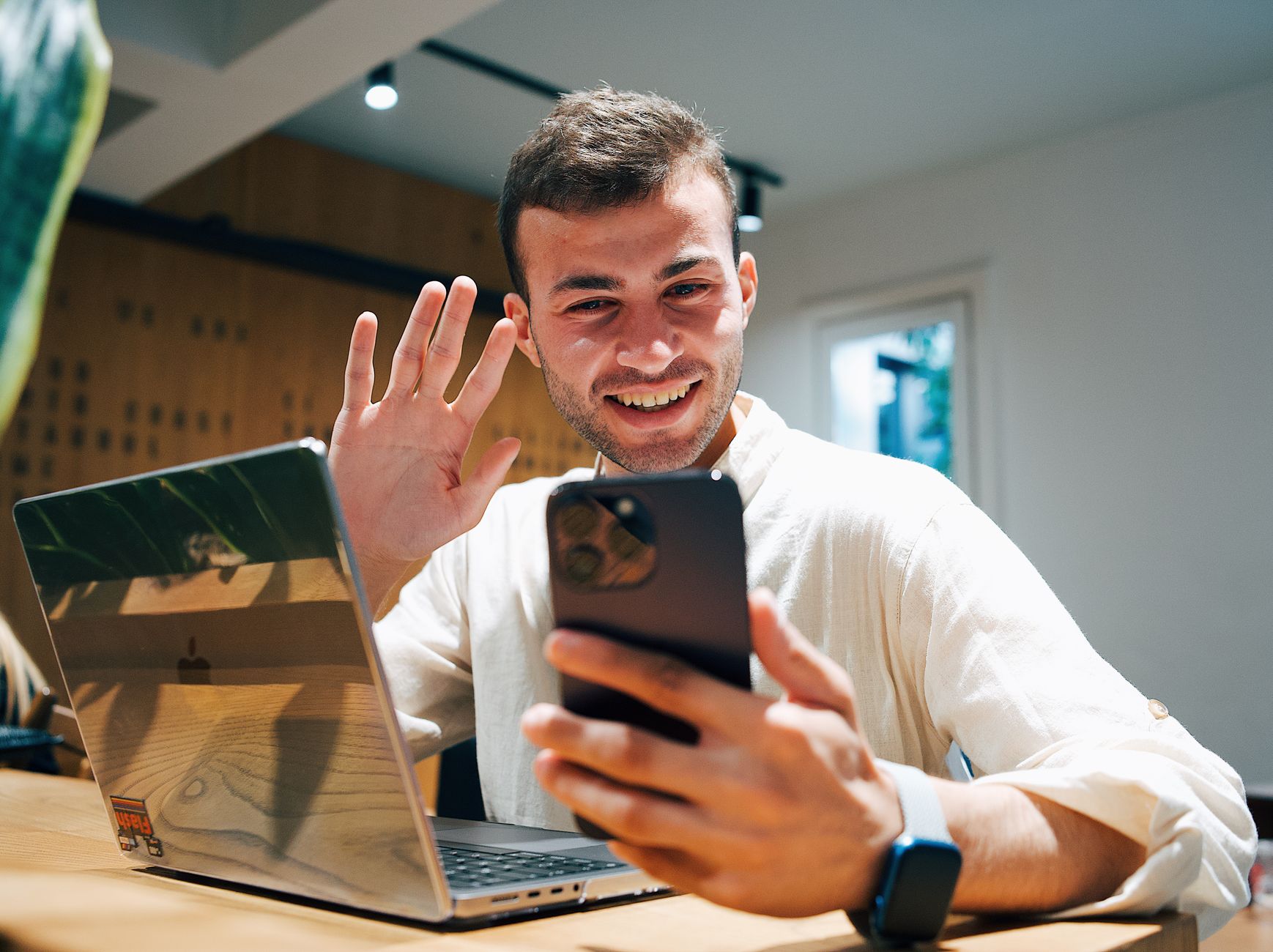 A coach on a personal video call with a new client during a kickoff session, representing the onboarding steps that should stay human