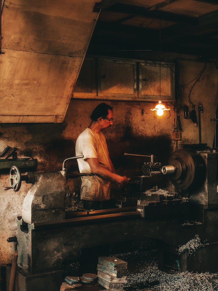 Blacksmith Working In Garage