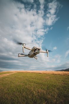 Drone captured flying over a scenic rural field in Liberec, Czechia on a clear day.
