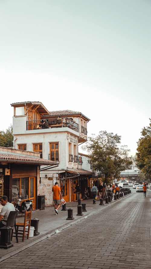 Free A picturesque street scene with local cafes and shops, perfect for urban explorations. Stock Photo