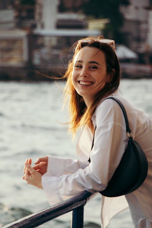 Smiling Woman in White Shirt