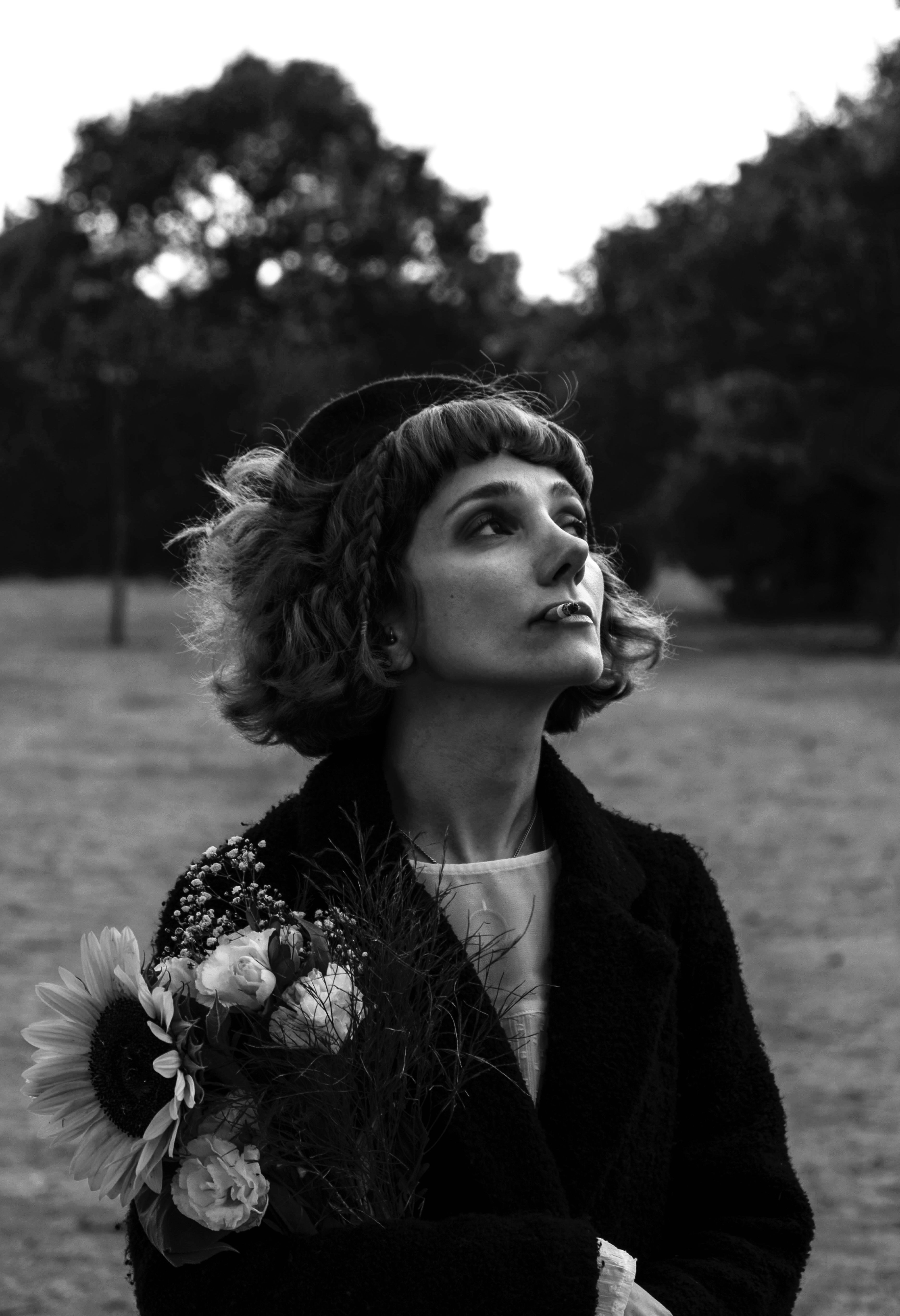 Portrait of Woman with Sunflower in Black and White · Free Stock Photo