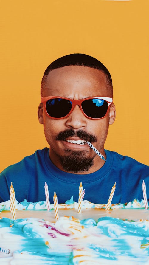 Portrait of a Man with a Candle in his Mouth and a Birthday Cake 