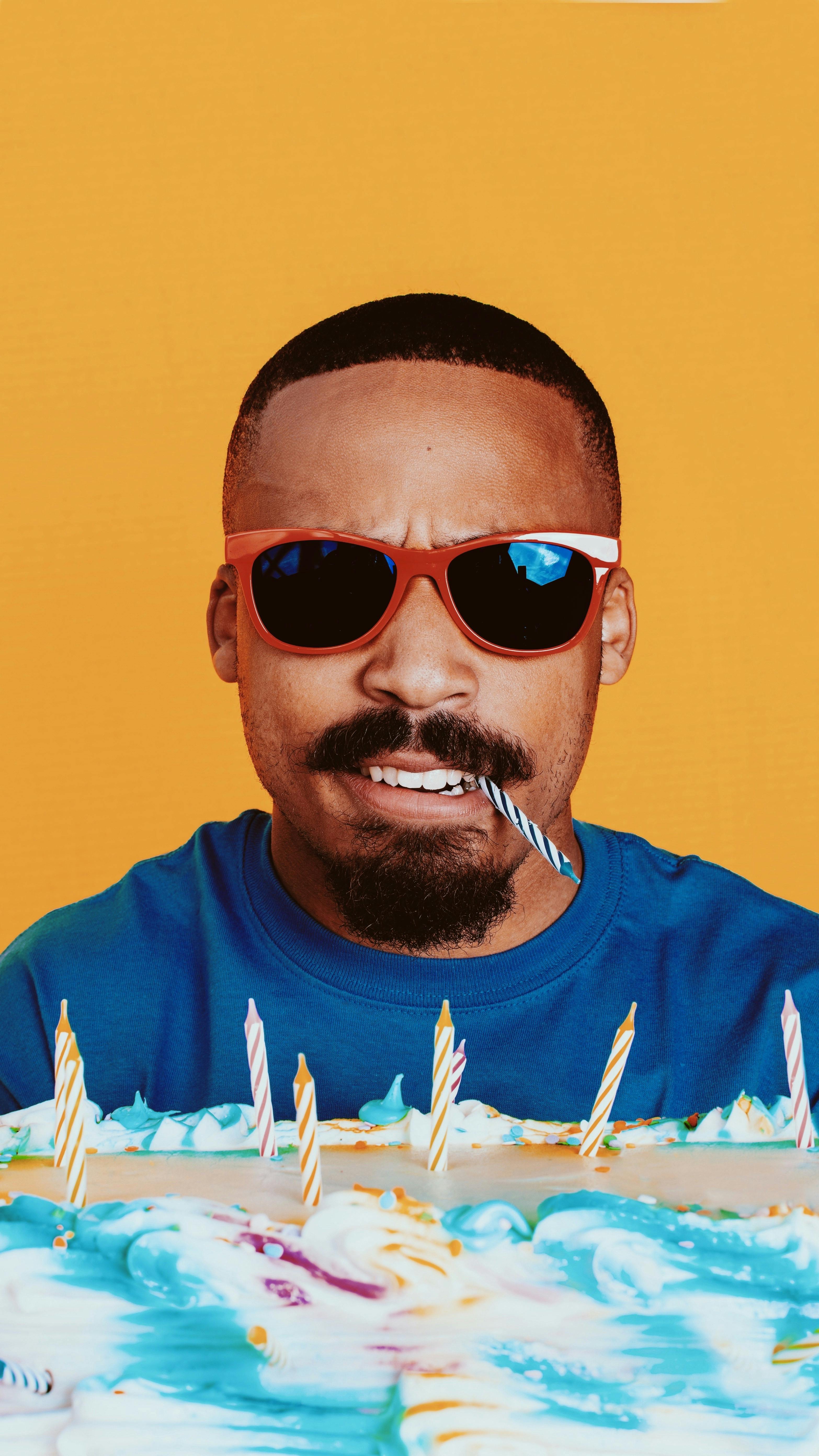 Portrait of a Man with a Candle in his Mouth and a Birthday Cake · Free